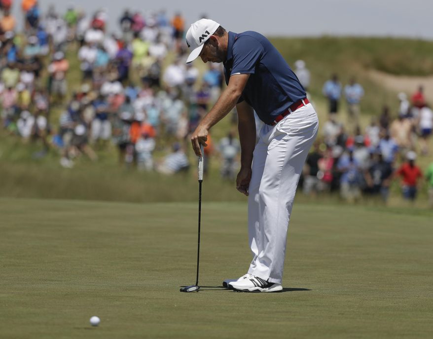 Sergio Garcia, of Spain, reacts after putting on the ninth hole during the second round of the U.S. Open golf tournament Friday, June 16, 2017, at Erin Hills in Erin, Wis. (AP Photo/Chris Carlson)