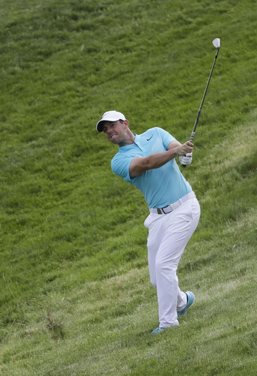 Rory McIlroy, of Ireland, hits to the 12th green during the second round of the U.S. Open golf tournament Friday, June 16, 2017, at Erin Hills in Erin, Wis. (AP Photo/David J. Phillip)