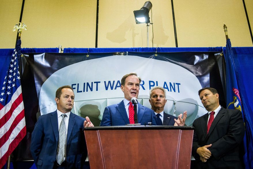 Michigan Attorney General Bill Schuette announces charges against five water officials, including the head of Michigan’s health department, Wednesday, June 14, 2017, at the Riverfront Banquet Center in downtown Flint, Mich. The officials were charged Wednesday with involuntary manslaughter in an investigation of Flint’s lead-contaminated water, all blamed in the death of an 85-year-old man who had Legionnaires’ disease  .(Jake May /The Flint Journal-MLive.com via AP)