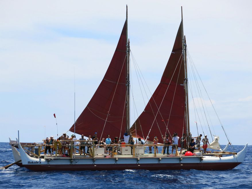 FILE - In this April 29, 2014 file photo, the Hokulea sailing canoe is seen off Honolulu. The Polynesian voyaging canoe is returning to Hawaii after a three-year journey around the world guided only by nature with navigators using no modern navigation to guide Hokulea across 40,000 nautical miles to 19 countries. Thousands are expected to welcome the double-hulled canoe to Oahu, Hawaii, on Saturday, June 17, 2017. (AP Photo/Sam Eifling, File)