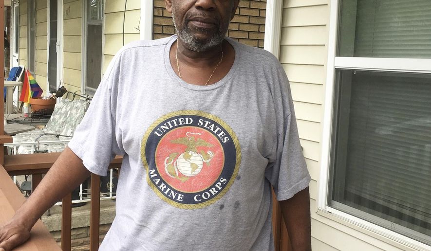 In a June 15, 2017 photo, Kevin Fantroy, 62, stands on his porch in Hamtramck, Mich. He and dozens of other black residents are challenging higher property tax bills. They say the higher taxes violate a settlement in a decades-old lawsuit over housing discrimination against blacks. (AP Photo/Ed White