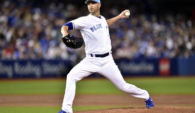 Toronto Blue Jays starting pitcher J.A. Happ throws to the Chicago White Sox during first-inning baseball game action in Toronto, Sunday, June 18, 2017.(Frank Gunn/The Canadian Press via AP)