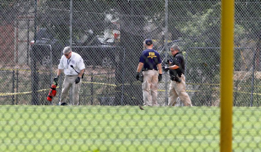 FBI agents searched for evidence on the baseball field in Alexandria, Virginia, where Republican lawmakers were attacked by a gunman. The frightening incident prompted some to call for easing local gun laws. (Associated Press)