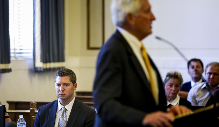 Ray Tensing, a former University of Cincinnati police officer, listens to Stew Mathews present closing arguments during his retrial at the Hamilton County Courthouse in Cincinnati, Monday, June 19, 2017. Tensing is charged with murder and voluntary manslaughter in the shooting of unarmed black motorist Sam DuBose during a 2015 traffic stop. (Cara Owsley/The Cincinnati Enquirer via AP, Pool)