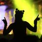 A woman dances as Hardwell performs at the Kinetic Field stage during the opening night of the Electric Daisy Carnival at the Las Vegas Motor Speedway in Las Vegas on Saturday, June 17, 2017. (Chase Stevens/Las Vegas Review-Journal via AP)