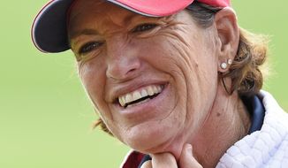 FILE - In this Sept. 18, 2015, file photo, Juli Inkster, team captain of the United States, smiles during the foursomes on Day 1 at the Solheim Cup golf tournament in St. Leon-Rot, southern Germany. The Des Moines Golf and Country Club held media day Monday, June 19, 2017, for the Solheim Cup, a three-day, biennial tournament between U.S. and European women’s golfers. (AP Photo/Jens Meyer, File)