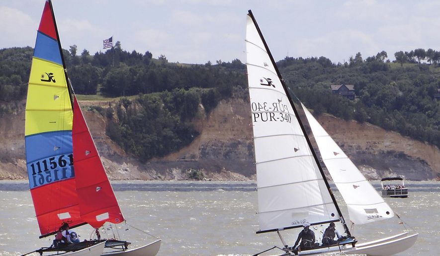 Sailors on hand for the Hobie 16/20 North American Championships tested out the waters of Lewis & Clark Lake Sunday, June 18, 2017 near Yankton, S.D. The event runs all week and will be based out of Hobie Cat Beach near Lewis & Clark Marina. (Kelly Hertz/Yankton Press & Dakotan via AP)