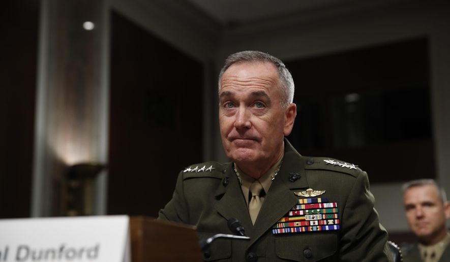 In this June 13, 2017, file photo, Joint Chiefs Chairman Gen. Joseph Dunford prepares to testify on Capitol Hill in Washington. Dunford said Monday, June 19, 2017, that Washington and Moscow are in delicate discussions to tamp down tensions arising from the U.S. shootdown of a Syrian fighter jet, which the Russians called a violation of a U.S.-Russian understanding on avoiding air incidents.  (AP Photo/Jacquelyn Martin, File)