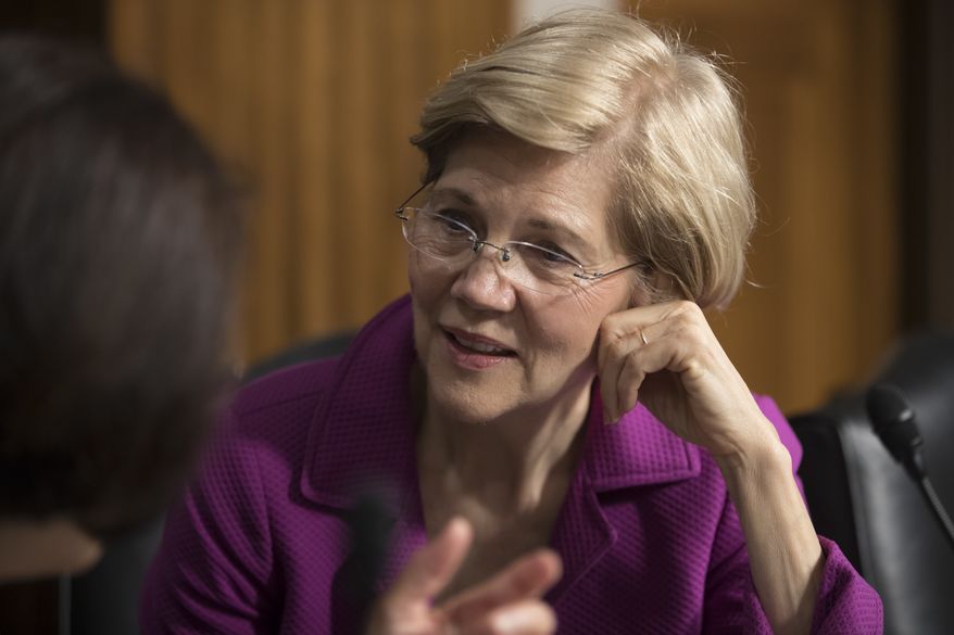 Sen. Elizabeth Warren, D-Mass., confers with Sen. Mazie Hirono, D-Hawaii, left, before the start of a Senate Armed Services Committee hearing at the Capitol in Washington, Tuesday, June 20, 2017. (AP Photo/J. Scott Applewhite)