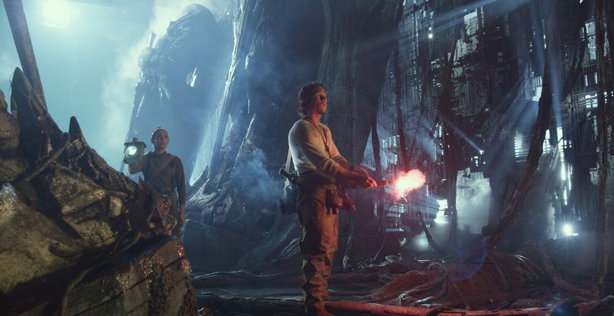 This image released by Paramount Pictures shows Laura Haddock as Viviane, left, and Mark Wahlberg as Cade Yeager in a scene from, "Transformers: The Last Knight." (Paramount Pictures/Bay Films via AP)