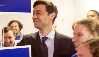 Jon Ossoff, candidate for congress in Georgia&#x27;s sixth congressional district, after speaking, poses for pictures with supporters and volunteers at the Sandy Springs Canvass Launch for Ossoff&#x27;s final day on the campaign trail.  Georgia voters steadily streamed into suburban Atlanta polling places Tuesday,  June 20, 2017, set to decide the most expensive House race in U.S. history and put weeks of television ads, phone calls and ringing doorbells behind them. Either Republican Karen Handel will claim a seat that’s been in her party’s hands since 1979 or Democrat Ossoff will manage an upset that will rattle Washington ahead of the 2018 midterm elections.  (Chad Rhym/Atlanta Journal-Constitution via AP)