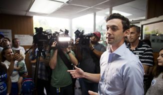 Jon Ossoff, Democratic candidate for Georgia&#39;s 6th Congressional District talks to supporters during a stop at a campaign office in Chamblee, Ga., Monday, June 19, 2017. The race between Ossoff and Republican Karen Handel is seen as a significant political test for the new Trump Administration. The district traditionally goes Republican, but most consider the race too close to call as voters head to the polls on Tuesday. (AP Photo/David Goldman)