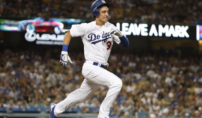 Los Angeles Dodgers&#x27; Cody Bellinger runs to first base after hitting a ground ball during the fourth inning of a baseball game against the New York Mets, Tuesday, June 20, 2017, in Los Angeles. Bellinger was out at first. (AP Photo/Jae C. Hong)