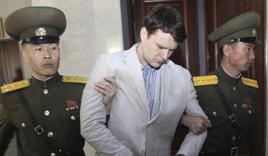 In this March 16, 2016, file photo, American student Otto Warmbier, center, is escorted at the Supreme Court in Pyongyang, North Korea. (AP Photo/Jon Chol Jin, File)