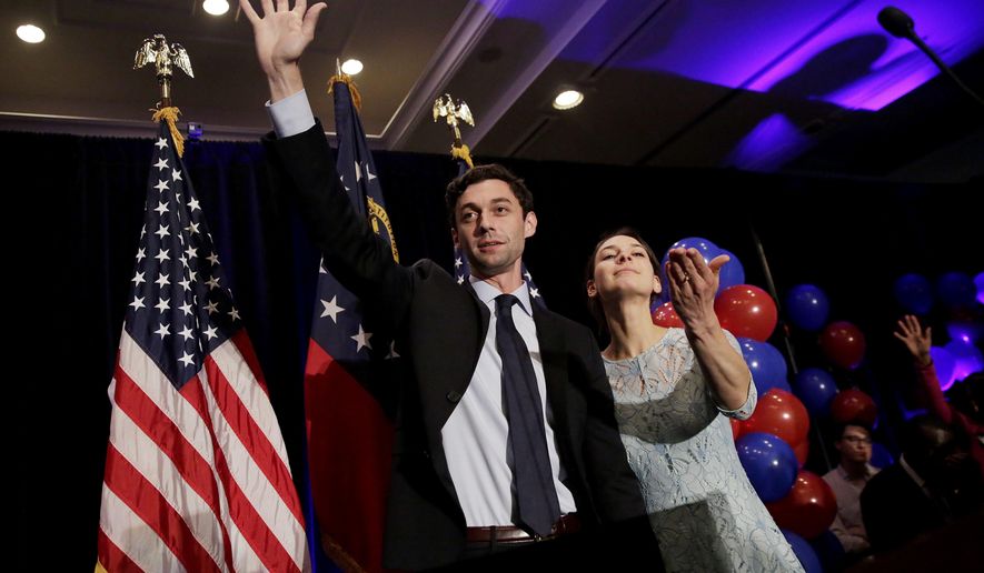 Democratic candidate for 6th Congressional District Jon Ossoff, left, concedes to Republican Karen Handel while joined by his fiancee Alisha Kramer at his election night party in Atlanta, Tuesday, June 20, 2017. (AP Photo/David Goldman)