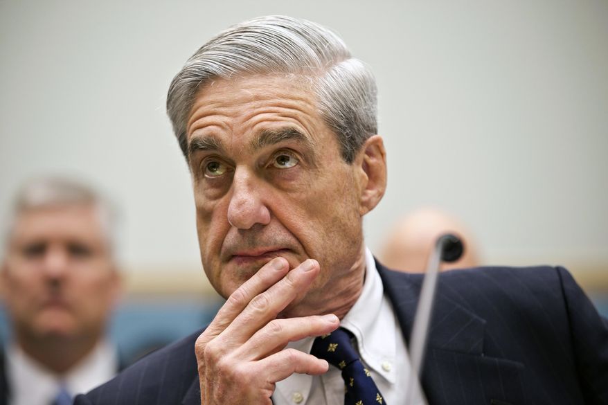 Then-FBI Director Robert Mueller listens as he testifies on Capitol Hill in Washington, as the House Judiciary Committee held an oversight hearing on the FBI in this June 13, 2013, file photo.  (AP Photo/J. Scott Applewhite) ** FILE **