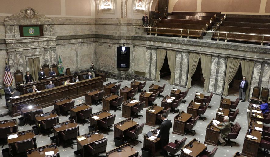 Republican Sen. Joe Fain, standing bottom center, speaks on the Senate floor during adjournment of a second special session on Wednesday, June 21, 2017, in Olympia, Wash. Lawmakers will need a third special session to complete their work on a new two-year state budget. (AP Photo/Rachel La Corte)