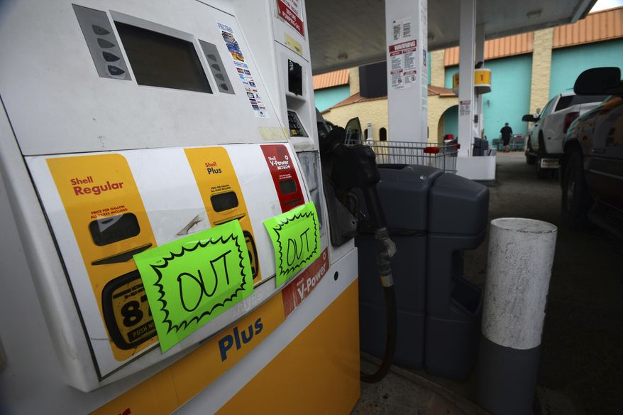 Signage indicates to drivers that The Big Store on Bolivar Peninsula, Texas is out of gas as a storm pushed towards landfall Wednesday, June 21, 2017. Texas Gov. Greg Abbott has ordered the State Operations Center to raise its readiness level. He also activated four Texas Task Force 1 boat squads and two Texas Military Department vehicles squads of five vehicles each to respond to any weather-related emergencies. (Guiseppe Barranco/The Beaumont Enterprise via AP)