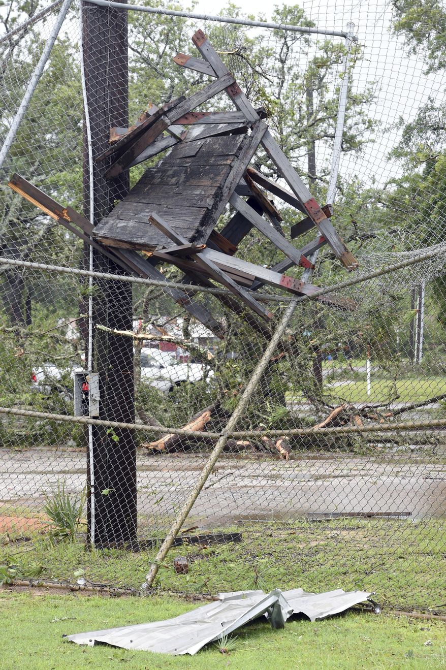 A wooden structure is embedded in backstop of a baseball field in Fort Walton Beach, Fla., Wednesday, June 21, 2017. A line of severe weather from Tropical Storm Cindy battered this northwest Florida community early Wednesday morning. [Devon Ravine/Northwest Florida Daily News via AP)
