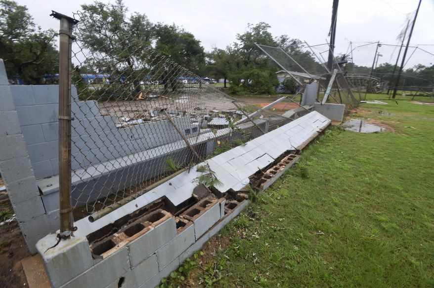 The dugout of a baseball field is destroyed in Fort Walton Beach, Fla., on Tuesday, June 20, 2017, as severe weather from Tropical Storm Cindy brushed along the northwest coast of Florida Wednesday morning. (Devon Ravine/Northwest Florida Daily News via AP)