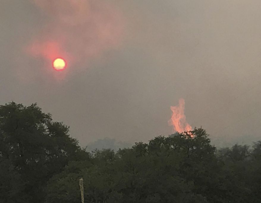 This photo provided by Ann Alden shows the Encino Fire in Sonoita, Ariz., Tuesday, June 20, 2017. An extreme heat wave in the Southwest U.S. made the fight against a series of wildfires more difficult . (Ann Alden via AP)