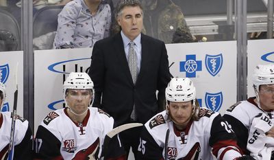 FILE - In this Dec. 12, 2016, file photo, Arizona Coyotes coach Dave Tippett stands behind his bench during the team&#39;s NHL hockey game against the Pittsburgh Penguins in Pittsburgh. The Coyotes and Tippett have mutually agreed to part ways after eight seasons. The 55-year-old Tippett led the Coyotes through four years of being run by the NHL after the team went into bankruptcy and took the Coyotes to the 2012 Western Conference Finals. He went 282-257-83 in the desert. (AP Photo/Gene J. Puskar, File)