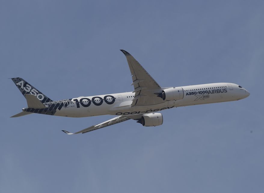 An Airbus 350-1000 performs his demonstration flight at Paris Air Show, in Le Bourget, east of Paris, France, Tuesday, June 20, 2017 in Paris. Aviation professionals and spectators are expected at this week&#x27;s Paris Air Show, coming in, in a thousands from around the world to make business deals. (AP Photo/Michel Euler)
