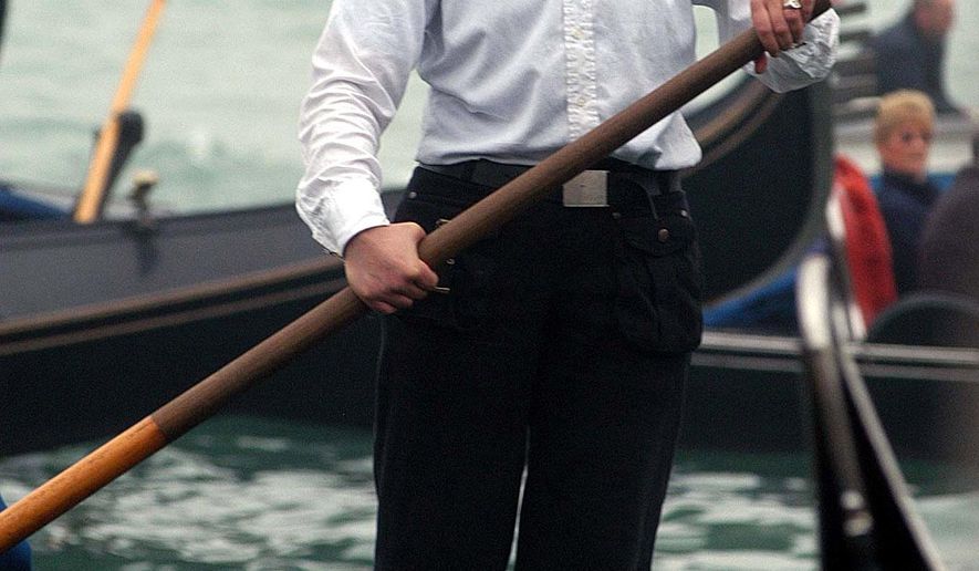 Alex Hai is seen as he rows on a gondola in Venice in an undated file photo. Hai, a gondolier who made headlines a decade ago for being Venice's first official female gondolier has announced he is transgender. Alex Hai made the revelation Wednesday, June 21, 2017, on Facebook and in a lengthy interview on Radiolab. (Andrea Merola/ANSA via AP)