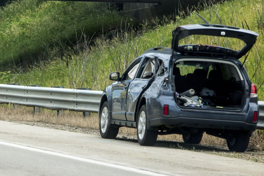 In this Wednesday, June 21, 2017 photo, a vehicle sits at the scene of a crash on U.S. 131, which caused multiple critical injuries, in Kalamazoo, Mich. (Carly Geraci /Kalamazoo Gazette-MLive Media Group via AP)