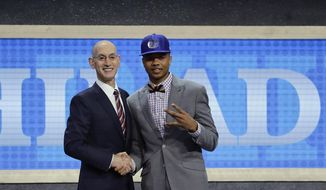 Washington&#x27;s Markelle Fultz, right, poses for a photo with NBA Commissioner Adam Silver after being selected by the Philadelphia 76ers as the No. 1 pick overall during the NBA basketball draft, Thursday, June 22, 2017, in New York. (AP Photo/Frank Franklin II)