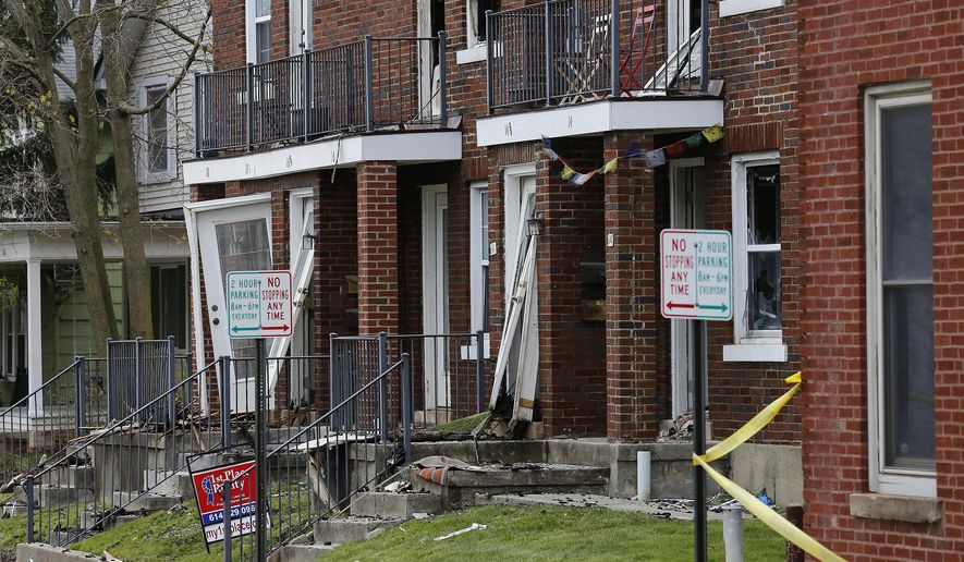 FILE – This April 10, 2016, file photo shows the charred remains of an apartment building following an overnight standoff between an apartment resident and SWAT officers in the Clintonville neighborhood of Columbus, Ohio. A jury convicted Lincoln Rutledge of aggravated murder Thursday, June 22, 2017, for fatally shooting Columbus, Ohio, SWAT officer Steven M. Smith in the head April 10, 2016, as officers tried to arrest Rutledge on an arson warrant. Smith died two days later. (Adam Cairns/The Columbus Dispatch via AP)