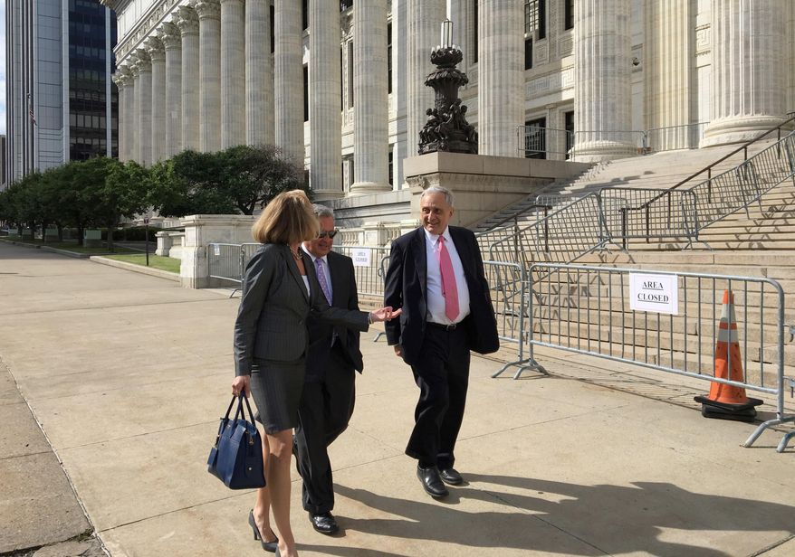 Carl Paladino, right, walks with his lawyers outside the state Department of Education building after the first day of testimony before Education Commissioner MaryEllen Elia, who will decide if Paladino should be removed from his position on the Buffalo Board of Education, Thursday, June 22, 2017, in Albany, N.Y. (AP Photo/Mary Esch)