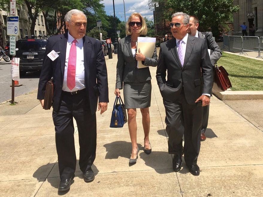 Carl Paladino, left, walks with his his lawyers Jennifer Persico and Dennis Vacco outside education building during break in a hearing on Thursday, June 22, 2017 in Albany, N.Y. Several days of hearings are scheduled in Albany for wealthy developer Carl Paladino to determine whether his public release of information on teacher contract talks should cost him his position on the Buffalo School Board. (AP Photo/Mary Esch)