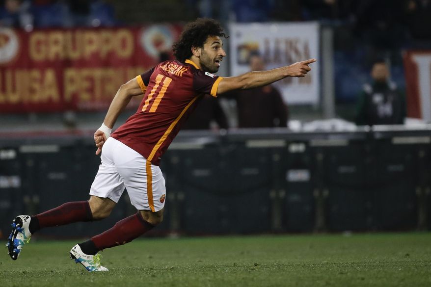 FILE - In this Monday, April 11, 2016 file photo, Roma's Mohammed Salah celebrates after scoring during their Serie A soccer match against Bologna, in Rome's Olympic stadium. Egypt winger Mohamed Salah will get another chance to prove himself in the English Premier League after sealing a move to Liverpool from Roma on Thursday, June 22, 2017. The 25-year-old Salah made just six league starts during his time playing for Chelsea from February 2014 to February 2015 before being sent on loan first to Fiorentina and then Roma. (AP Photo/Gregorio Borgia, file)