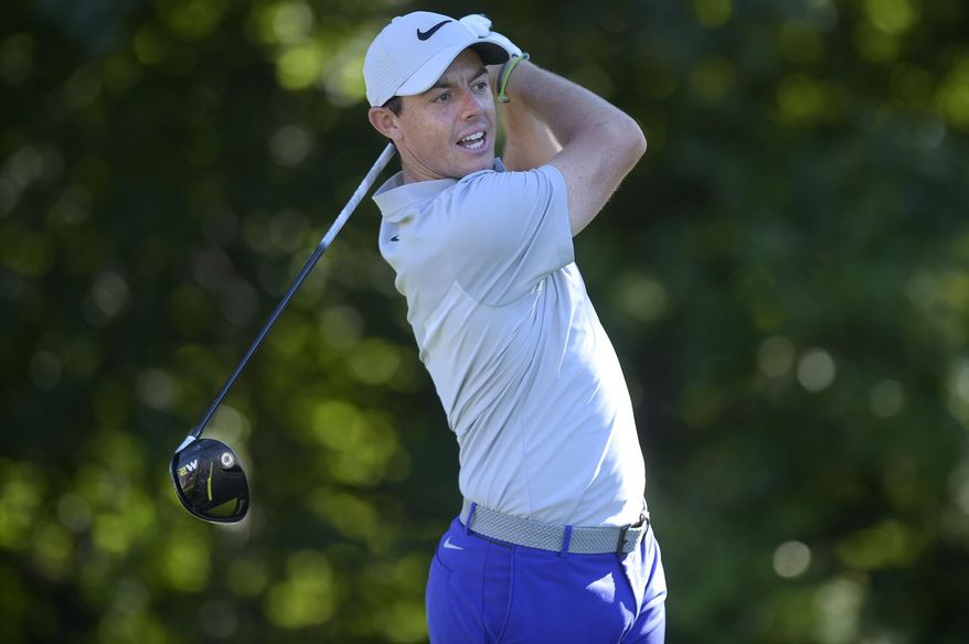 Rory McIlroy watches his drive go left from the 13th tee during the first round of the Travelers Championship golf tournament Thursday, June 22, 2017, in Cromwell, Conn. (Patrick Raycraft/Hartford Courant via AP)