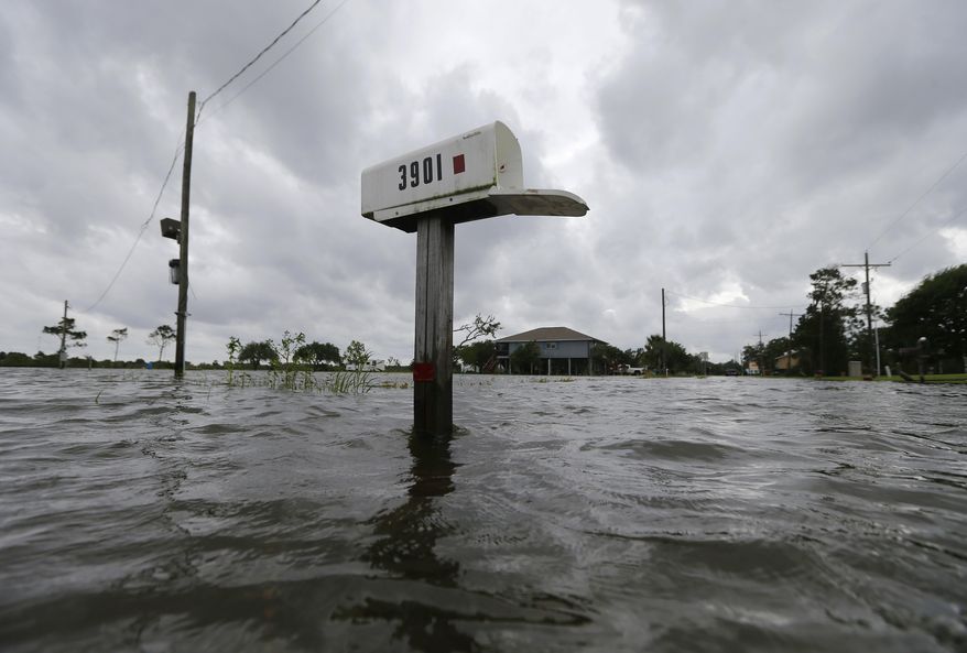 A mailbox sticks out of water during neighborhood flooding after Tropical Storm Cindy, now downgraded to Tropical Depression Cindy, in Big Lake, La., Thursday, June 22, 2017. (AP Photo/Gerald Herbert)