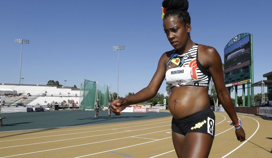 Alysia Montano, who is five months pregnant, walks to the starting line for a heat in the first round of the women's 800 meters at the U.S. Track and Field Championships, Thursday, June 22, 2017, in Sacramento, Calif. (AP Photo/Rich Pedroncelli)