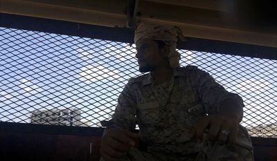 Naquib al-Yahri, the chief of Aden Central Prison, sits in the facility in this May 9, 2017 photo in Aden, Yemen. A Yemeni security force created by the United Arab Emirates runs a closed wing, part of a network of secret prisons in southern Yemen where hundreds have disappeared during the hunt for al-Qaida suspects. Al-Yahri denied any abuses in  his prison, but former detainees have reported widespread torture around the network. In Aden, prisons have been set up in military bases, basements of villas and even inside a nightclub, rights workers say. (AP Photo/Maad El Zikry)