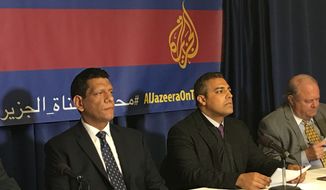Former Al Jazeera journalists Mohamed Fawzi (let) and Mohamed Fahmy speak at a press conference in Washington, D.C., on Thursday about their lawsuit against Al Jazeera, charging the network with negligence, breach of contract and misrepresentation. (Laura Kelly/The Washington Times)
