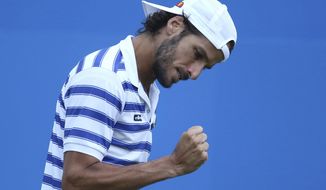 Spain&#39;s Feliciano Lopez celebrates during his match against Czech Republic&#39;s Tomas Berdych on day five of the Queen&#39;s Club tennis tournament in London, Friday June 23, 2017. (Steven Paston/PA via AP)