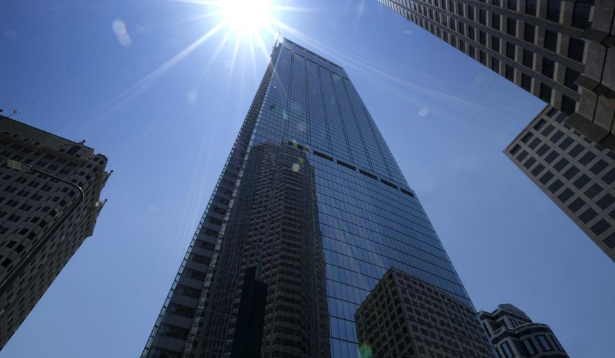 Downtown buildings are reflected in the newly build Wilshire Grand Center in Los Angeles on Thursday, June 22, 2017. The 73-story, 1,100-foot-high (335.3 meters) Wilshire Grand Center, the tallest building west of the Mississippi, opens Friday, celebrating with lights and fanfare in a once-stodgy downtown that has erupted in new skyscrapers. (AP Photo/Richard Vogel)