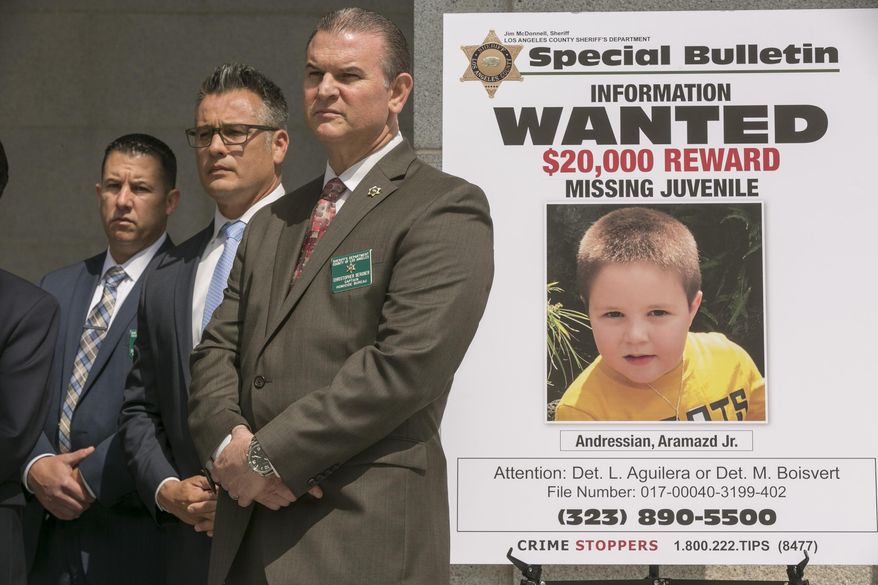 FILE - In this May. 17, 2017, file photo, Los Angeles County Sheriff's Department Homicide Bureau Capt. Christopher Bergner, center, stands by a poster of Aramazd Andressian Jr., a 5-year-old boy who has been missing for several weeks from South Pasadena, Calif., at a news conference outside the Hall of Justice in Los Angeles. The Los Angeles County Sheriff's Department says the father of a 5-year-old who has been missing for two months, 35-year-old Aramazd Andressian Sr. was arrested on Friday, June 23, 2017, afternoon in Las Vegas and is being held there on $10 million bail. (AP Photo/Damian Dovarganes)