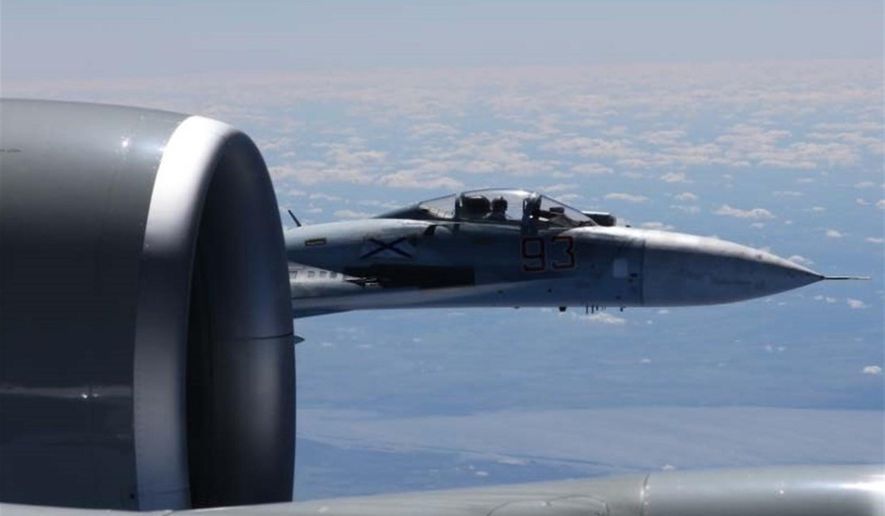This is a dramatic photo of a Russian jet coming within a few feet of a U.S. Air Force reconnaissance jet over the Baltic Sea June 19, 2017, in a maneuver that has been criticized as unsafe. The photographs released Friday june 23, 2017 show the Russian SU-27 coming so close to the wing of the U.S. RC-135U the Russian pilot can be seen sitting in the cockpit in some images. ( Master Sgt Charles Larkin Snr/U.S. European Command via AP)