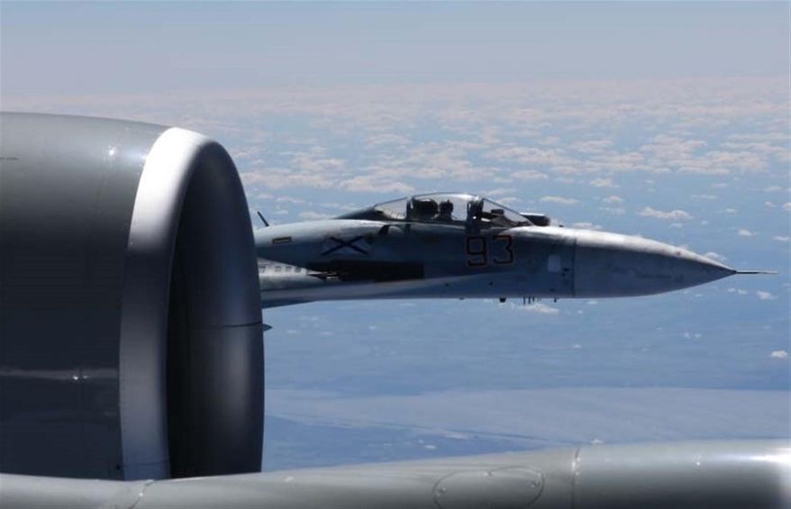 This is a dramatic photo of a Russian jet coming within a few feet of a U.S. Air Force reconnaissance jet over the Baltic Sea June 19, 2017, in a maneuver that has been criticized as unsafe. The photographs released Friday june 23, 2017 show the Russian SU-27 coming so close to the wing of the U.S. RC-135U the Russian pilot can be seen sitting in the cockpit in some images. ( Master Sgt Charles Larkin Snr/U.S. European Command via AP)