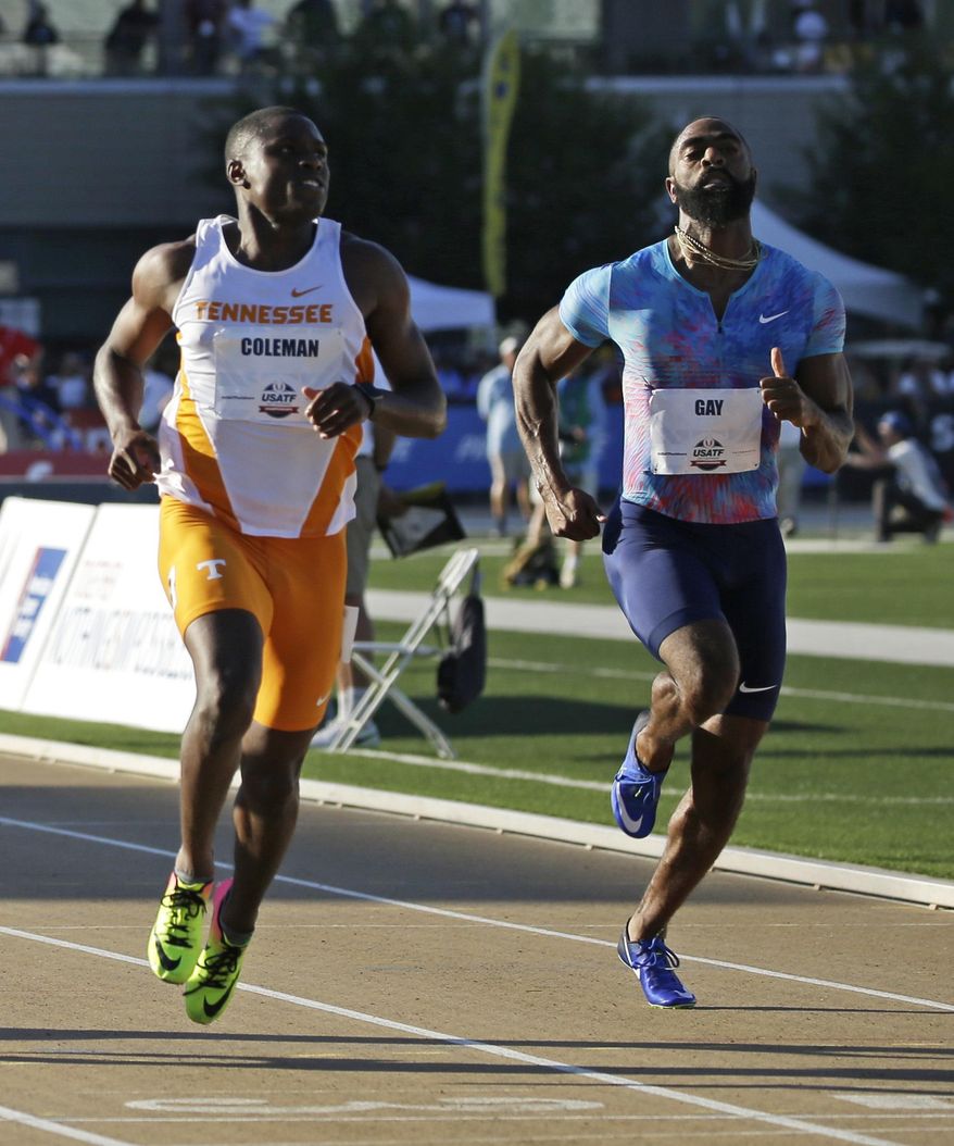Tyson Gay, right, races against Christian Coleman in a heat of the first round of the men's 100 meters at the U.S. Track and Field Championships, Thursday, June 22, 2017, in Sacramento, Calif. Gay just missed qualifying for the next round, but Coleman finished first. Gay has been running with a heavy heart since his 15-year-old daughter was shot and killed in October 2016 outside a restaurant in Kentucky. (AP Photo/Rich Pedroncelli)