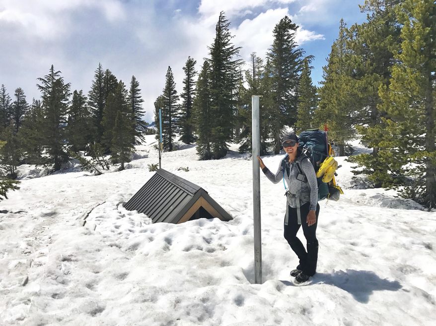 In this May 29, 2017, self portrait photo taken with the help of a timer, shows Anya Sellsted standing in Mammoth Lakes, Calif. Sellsted had traversed the highest snow-covered passes and forded raging rivers during her hike from Mexico to Canada when she ran into trouble in the high Sierra Nevada mountains. (Anya Sellsted AP)