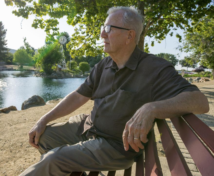 In this Friday, June 23, 2017 photo, Frank Kerrigan, looks at a pond near his Wildomar, Calif., home. Kerrigan, who thought his son Frank had died, learned he buried the wrong man. Kerrigan said the Orange County coroner's office mistakenly identified a body found dead on May 6 as that of his son. (Andrew Foulk/The Orange County Register via AP)
