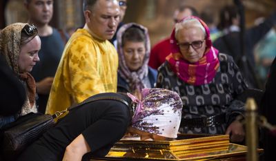 In this photo taken on Friday, May 26, 2017, Russian Orthodox believers line up to kiss the relics of Saint Nicholas that were brought from an Italian church where they have lain for 930 years, in the Christ the Savior Cathedral in Moscow, Russia. Over a million people have visited relics of Saint Nicholas, one of the Russian Orthodox Church&#39;s most revered figures, since they were brought to Moscow last month. (AP Photo/Alexander Zemlianichenko)
