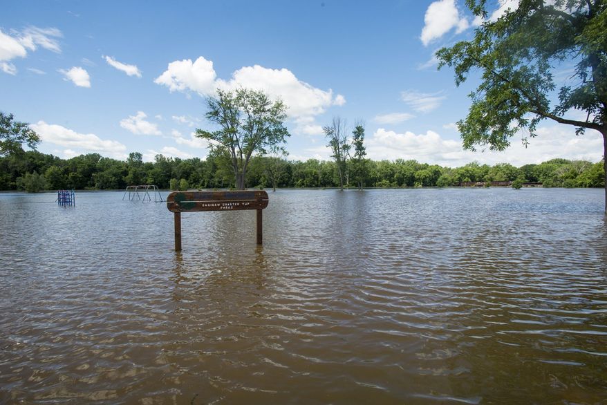 West Michigan Park in Saginaw Township, Mich., is underwater following heavy rains, Saturday, June 24, 2017. (Tori Scheider /The Bay City Times via AP)