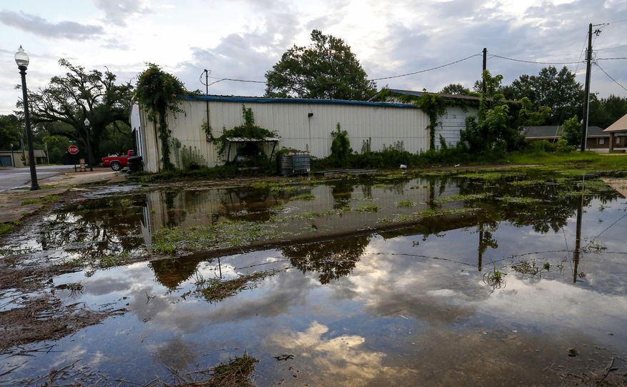 Standing water still remains in some parts of town after tropical storm Cindy brought heavy rain to the area, Saturday, June 24, 2017, in Leakesville, Miss. Flash flood watches are in effect until early Saturday in north central Tennessee, all of Kentucky and most of West Virginia as the remnants of a tropical storm head deeper inland. Others are in effect in the Mississippi and Ohio valleys. (AP Photo/Butch Dill)